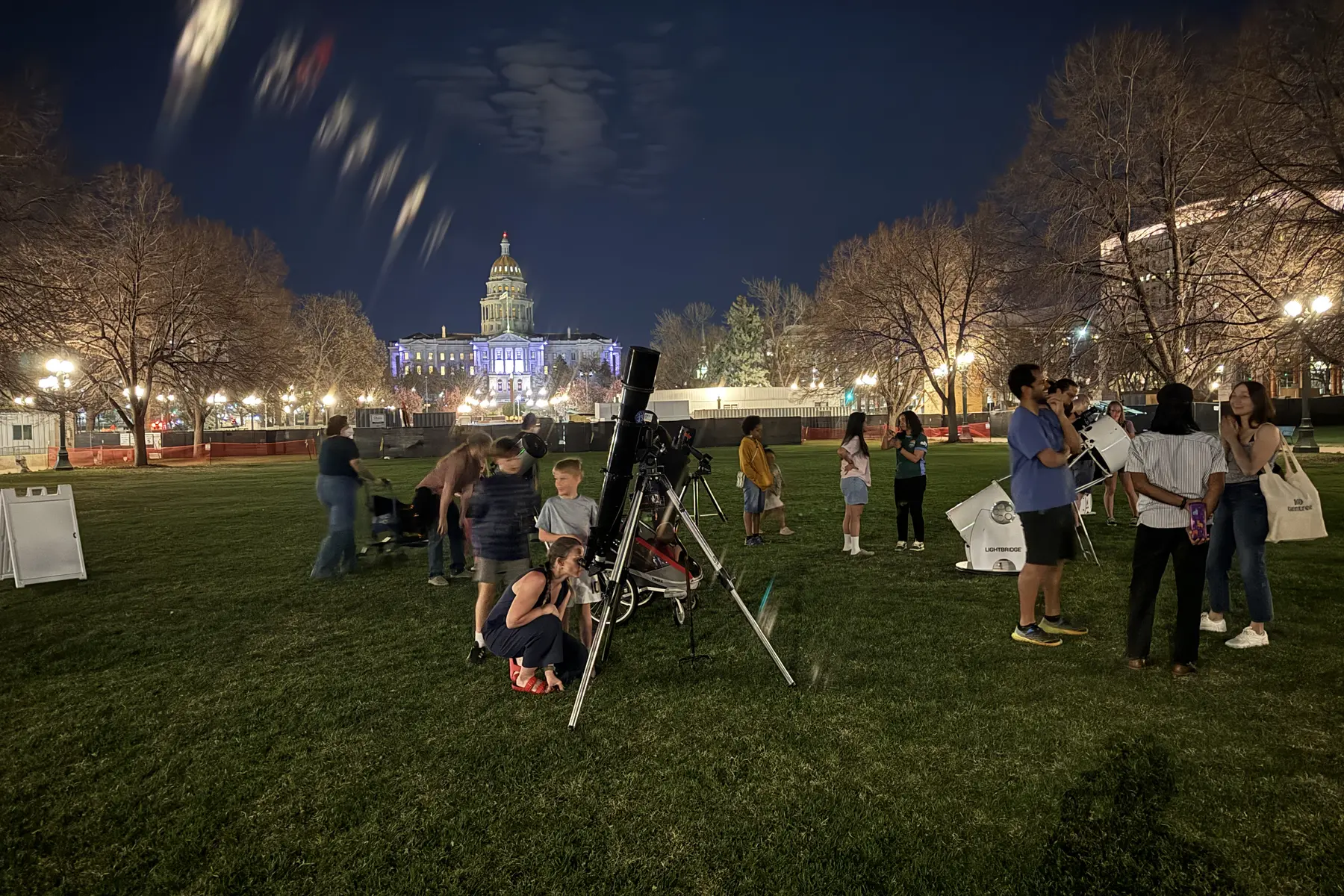 Civic Center Stargaze astronomy event in Denver with the Colorado State Capitol behind the crowd
