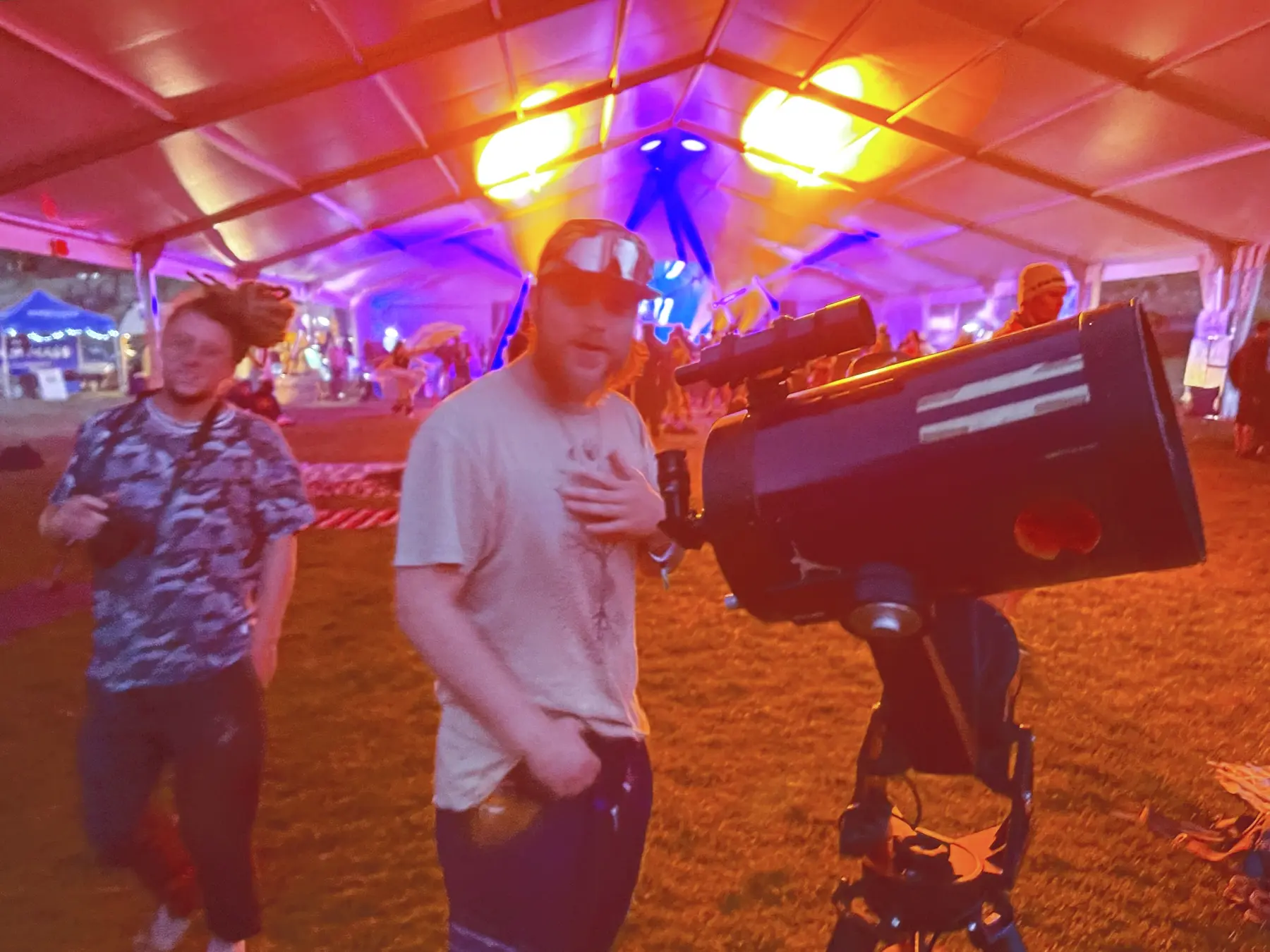 Visitors gathered at a real astronomy festival with telescopes and guides